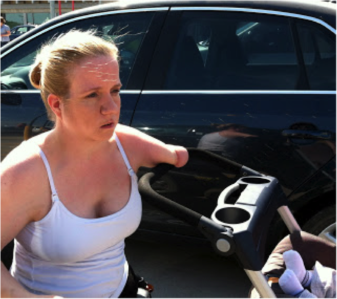 mother pushes stroller with one arm. the stroller has a single handlebar